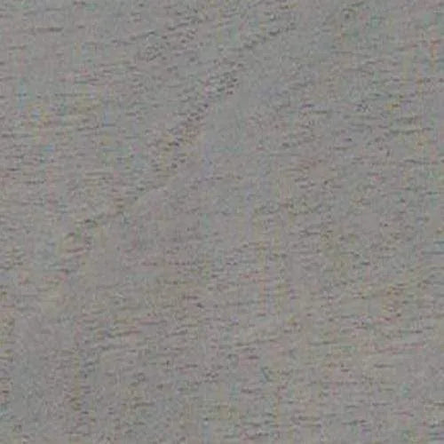 Primer plano de una superficie gris con una textura sutil, similar a la madera veteada o tejido rugoso.